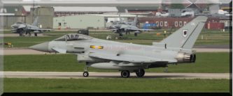 Razor 11 taxing to the runway with a pair of 29(R) Squadron Typhoons in the background